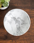 Merritt Designs White Marble Melamine 8 inch Round Salad Bowl in the kitchen on a wood table top
