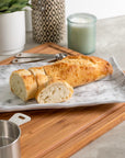 Merritt Designs White Marble 15.25 inch Rectangle Melamine Appetizer Tray serving fresh bread with your meal
