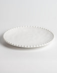 Cream colored, 8-inch round melamine salad plate, 3/4 view, Merritt Designs