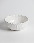Cream colored, 6-inch round melamine salad bowl with beaded rim, front view