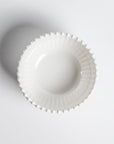 Cream colored, 6-inch round melamine salad bowl with beaded rim, top view