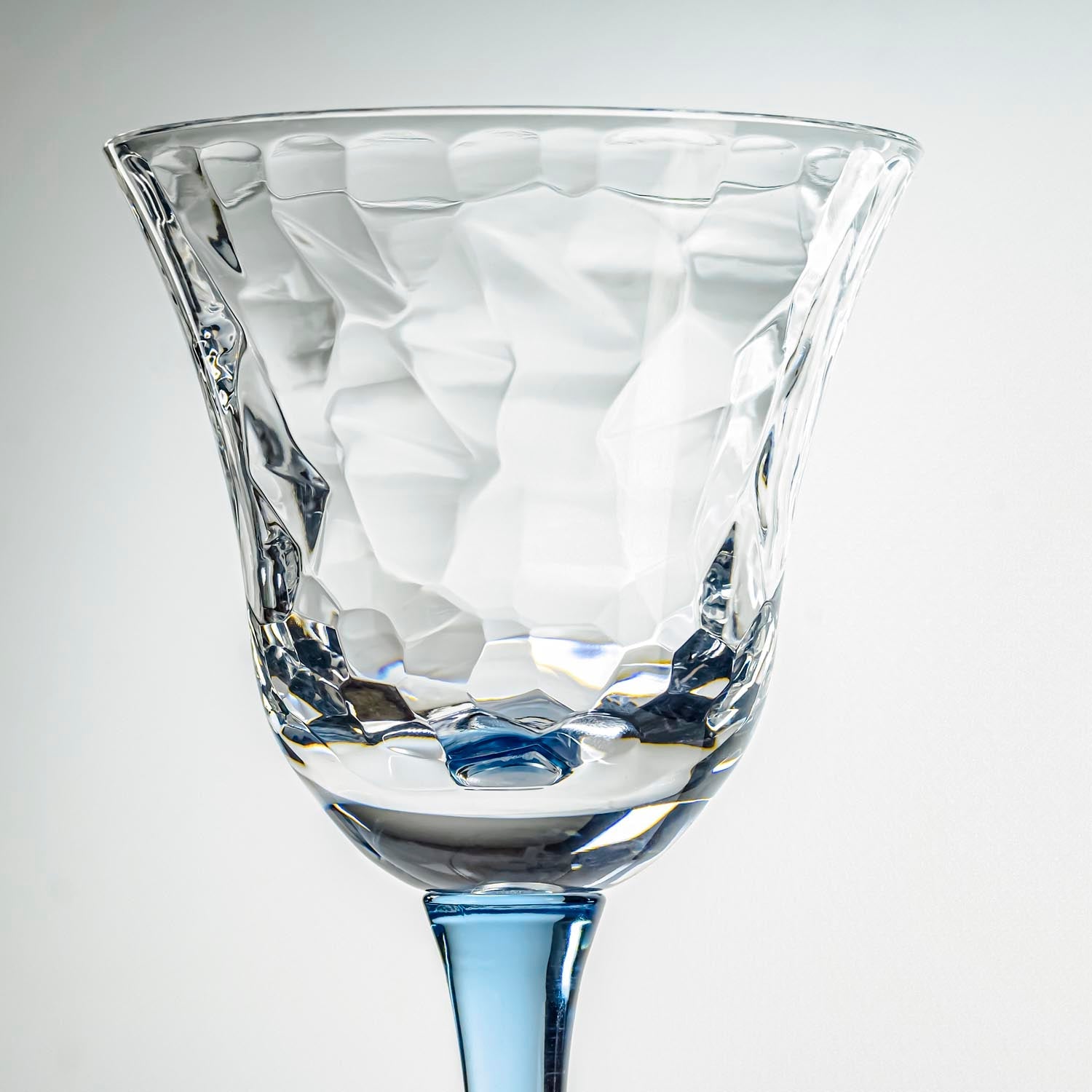 12-ounce blue acrylic wine glasses from the Merritt Designs Cascade collection. Detailed view on white background