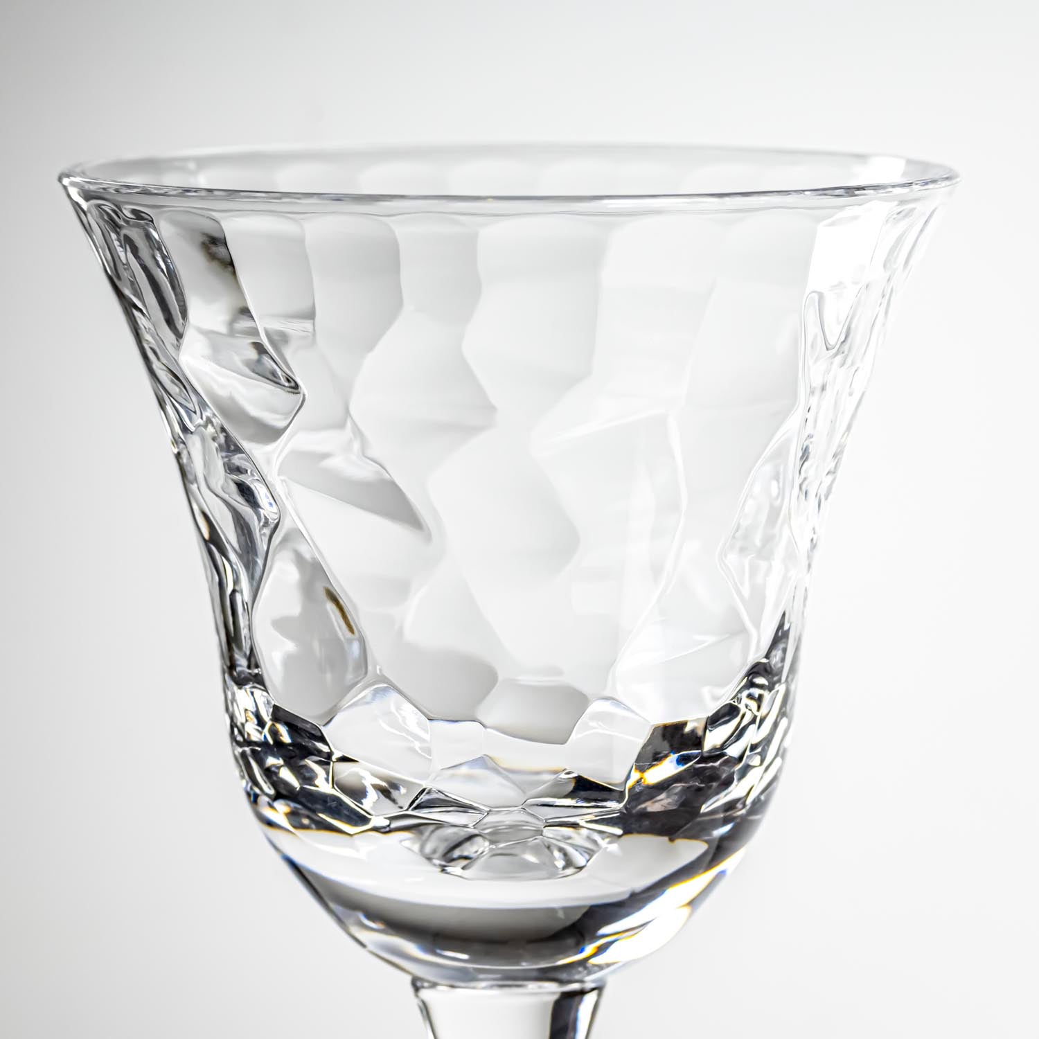 12-ounce clear acrylic wine glass from the Merritt Designs Cascade collection. Detailed view on white background