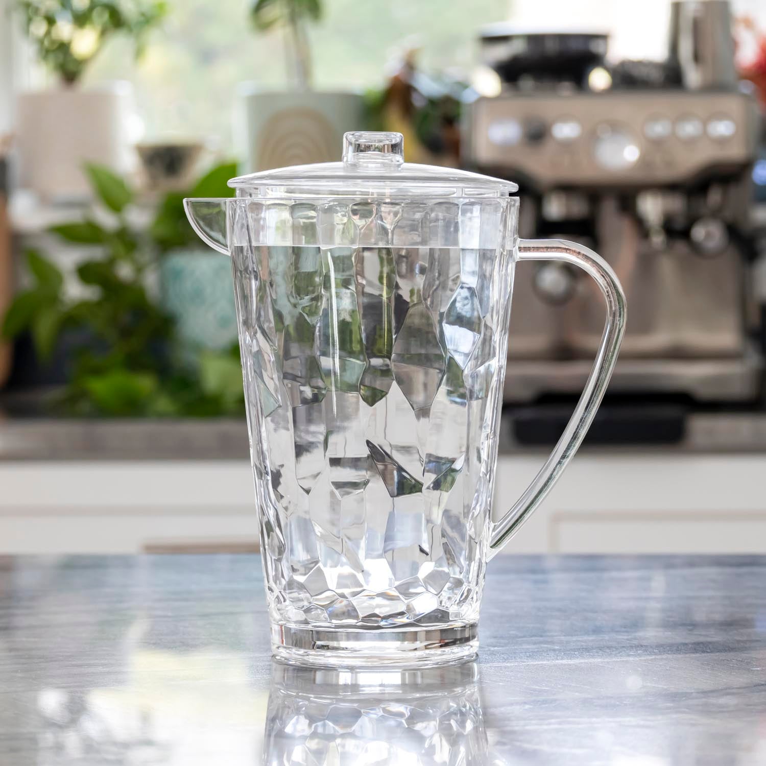 Clear, 64-ounce acrylic pitcher from the Merritt Designs Cascade collection on a kitchen counter