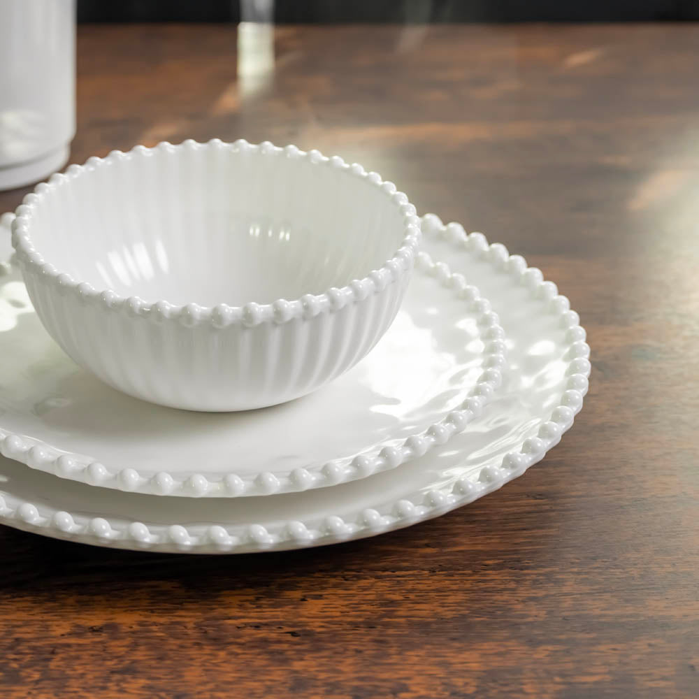 Merritt Designs Beaded Pearl 11 inch Melamine Dinner Plate Set Cream stacked salad plate and salad bowl on dark wood tabletop front view
