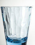 4-ounce blue acrylic tumbler glass from the Merritt Designs Cascade collection. Detailed view on white background