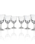 Set of 6, 10-ounce clear acrylic wine glasses in the Fiori collection by Merritt Designs. Front view on white background
